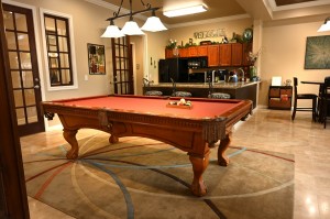 Apartments in Jersey Village, Texas - Clubhouse Billiards Table with View to Kitchen   